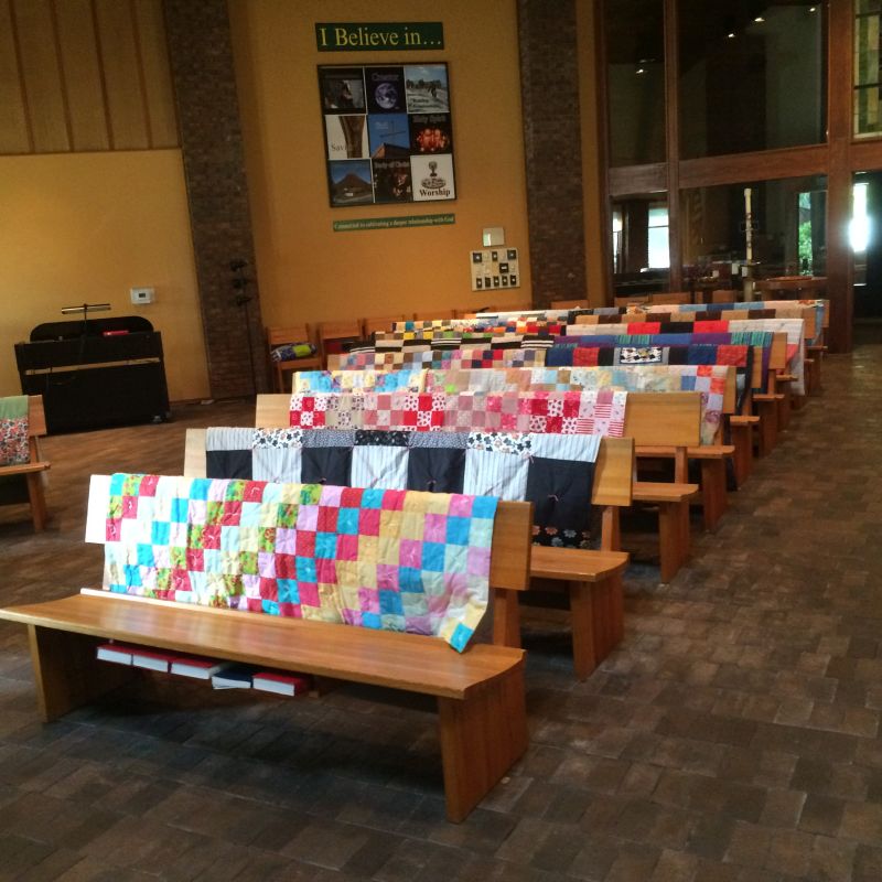 LWR quilts on the pews St. Peter Lutheran Church